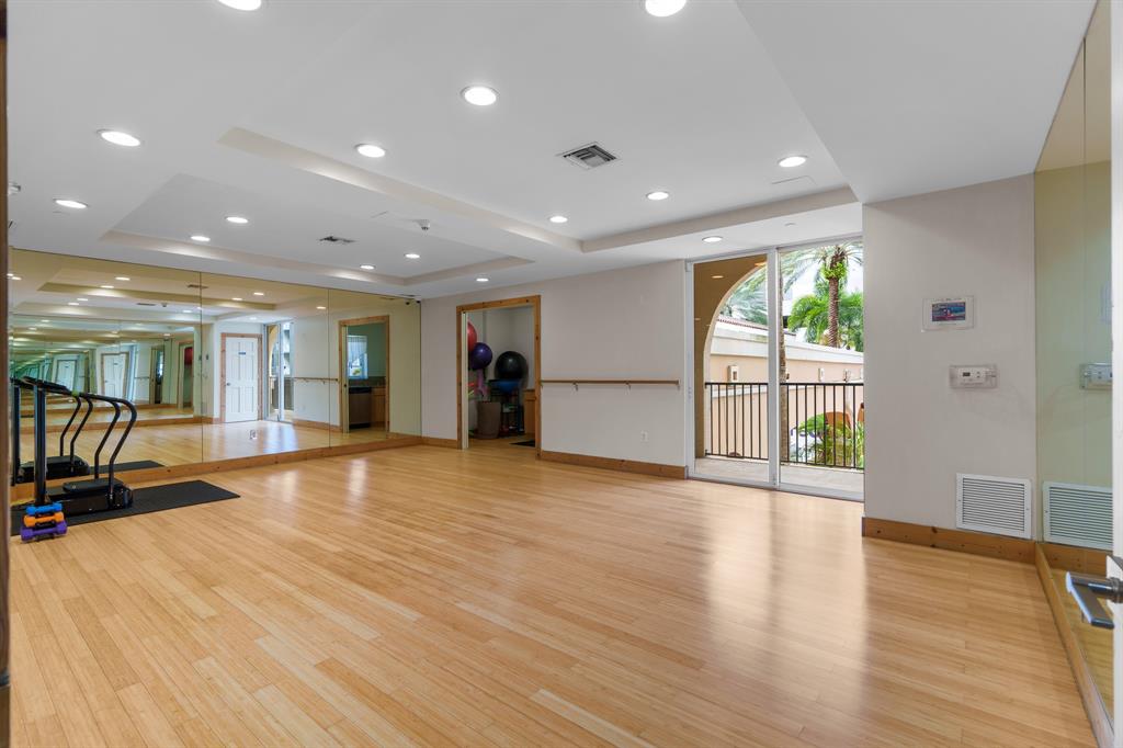 520 Southeast 5th Avenue, Unit 2209 Fort Lauderdale, FL 33301 - Photo 40 of 47 a view of an empty room with wooden floor and a window