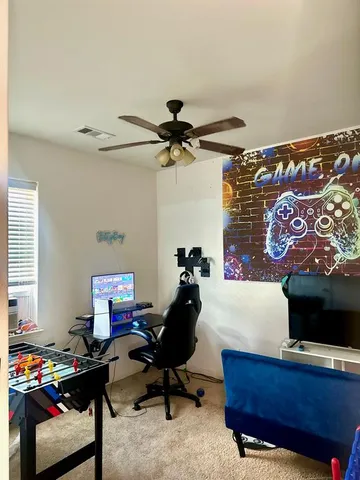 a workspace with furniture and screen