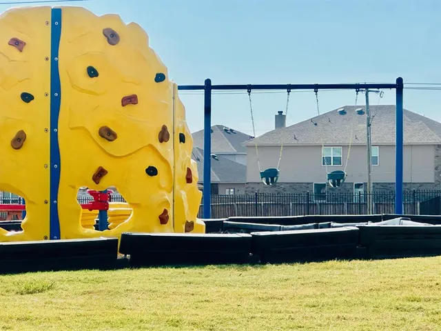 a view of swimming pool with a garden and seating area