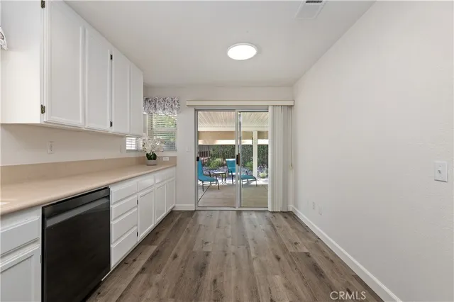 a bedroom with a bed and a potted plant