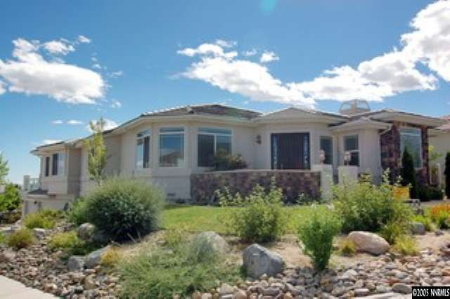 4800 Broken Arrow Circle Reno, NV 89509 - Photo 1 of 8 a front view of a house with a yard