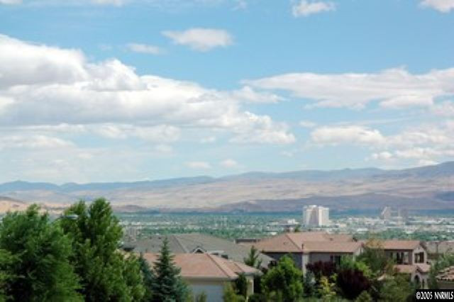 4800 Broken Arrow Circle Reno, NV 89509 - Photo 7 of 8 an aerial view of residential building with green space and mountain view in back