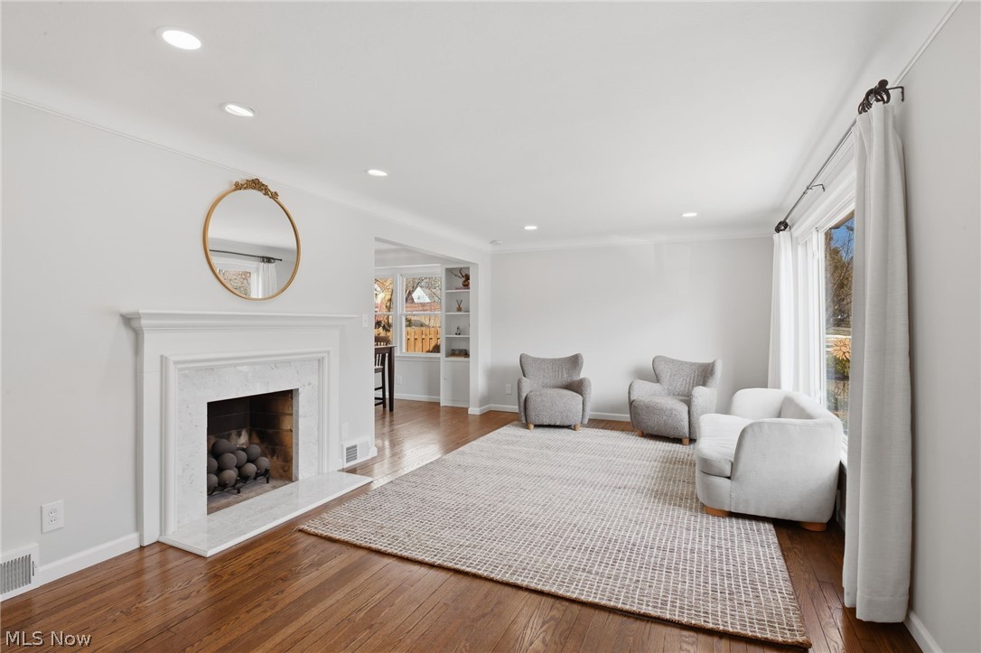 1390 Brainard Road Lyndhurst, OH 44124 - Photo 5 of 33 Living room featuring hardwood / wood-style flooring, recessed lighting, and a premium fireplace