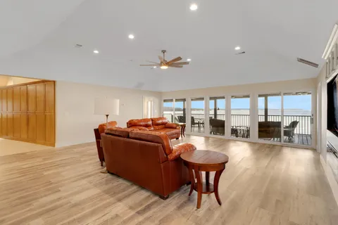 a view of a dining room with furniture wooden floor and chandelier