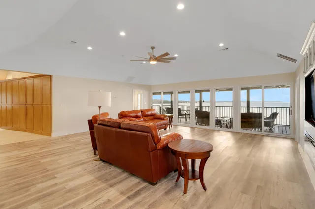 a view of a dining room with furniture wooden floor and chandelier