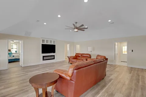 a view of a chairs and table in patio with wooden floor