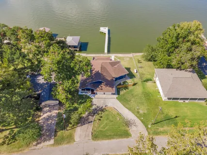 an aerial view of a house with outdoor space