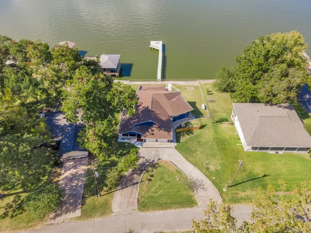 an aerial view of a house with outdoor space