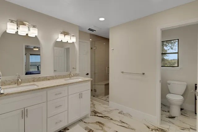 a bedroom with a bed and a couch