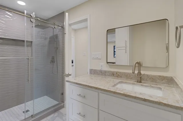 a view of a house with a swimming pool and sitting area