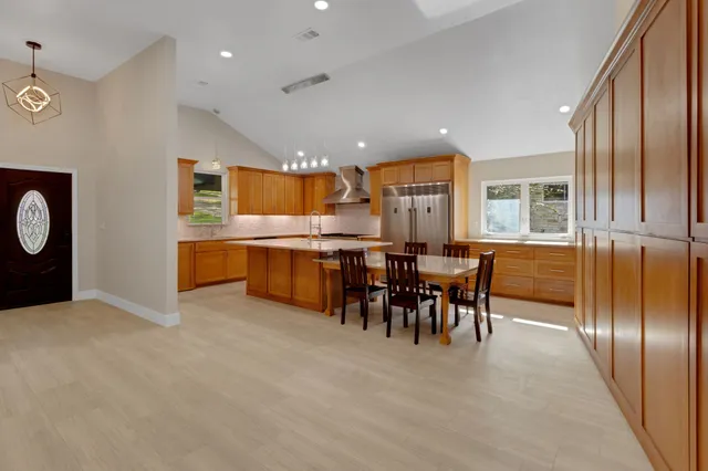 a kitchen with a stove and a table