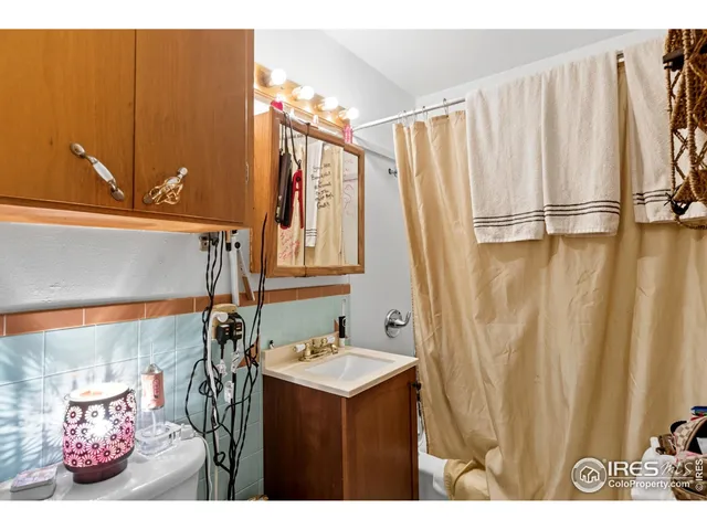 a front view of a house with garden and porch