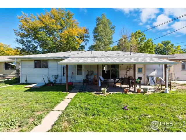 a kitchen with stainless steel appliances a refrigerator sink and cabinets