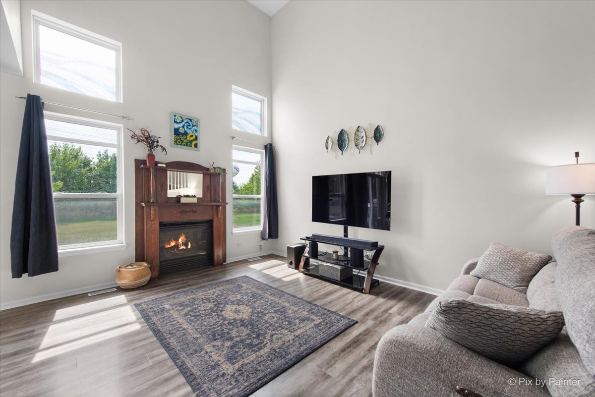 1033 Key Largo Drive Romeoville, IL 60446 - Photo 10 of 30 a living room with furniture or fireplace and a flat screen tv