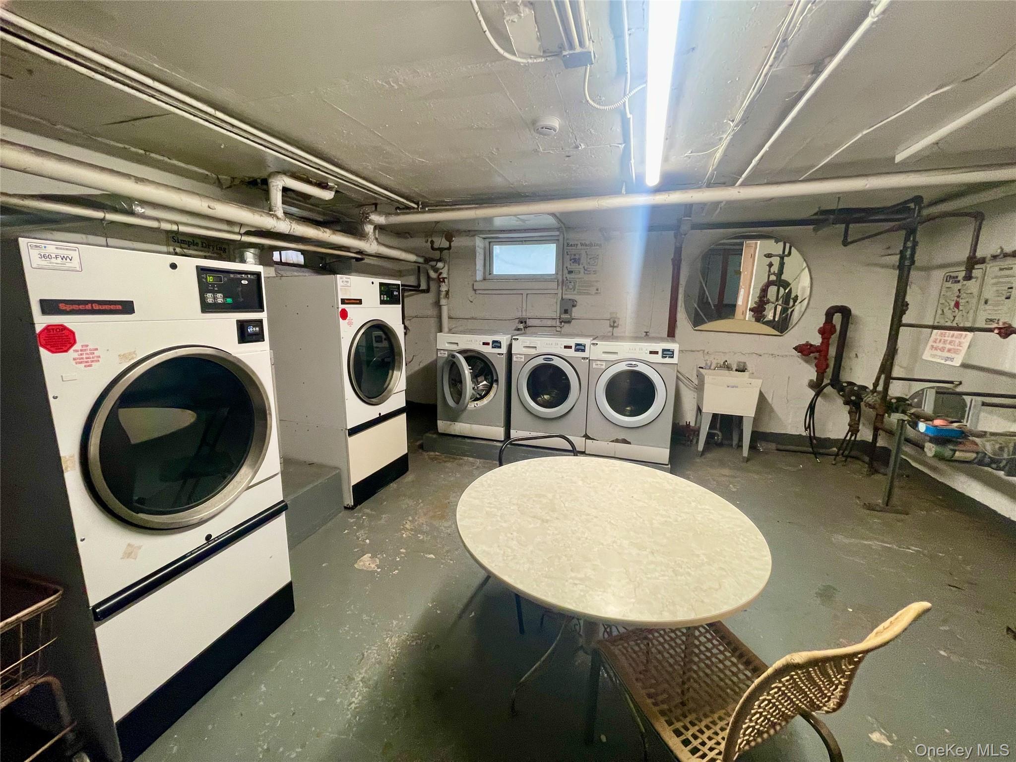 62-64 Saunders Street, Unit 1A Queens, NY 11374 - Photo 18 of 20 a utility room with dryer and washer