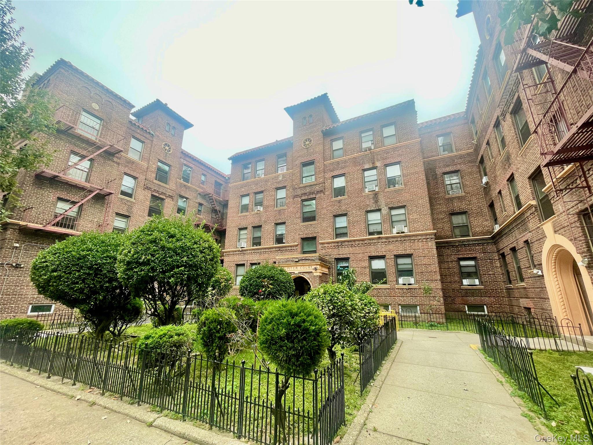 62-64 Saunders Street, Unit 1A Queens, NY 11374 - Photo 2 of 20 a view of a building with garden