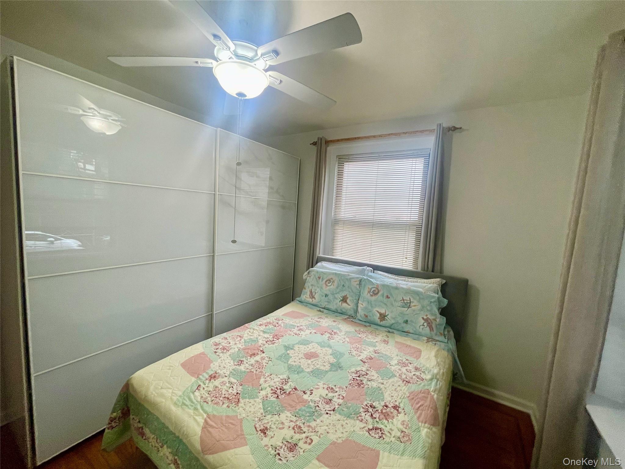 62-64 Saunders Street, Unit 1A Queens, NY 11374 - Photo 6 of 20 a bedroom with a bed and a window