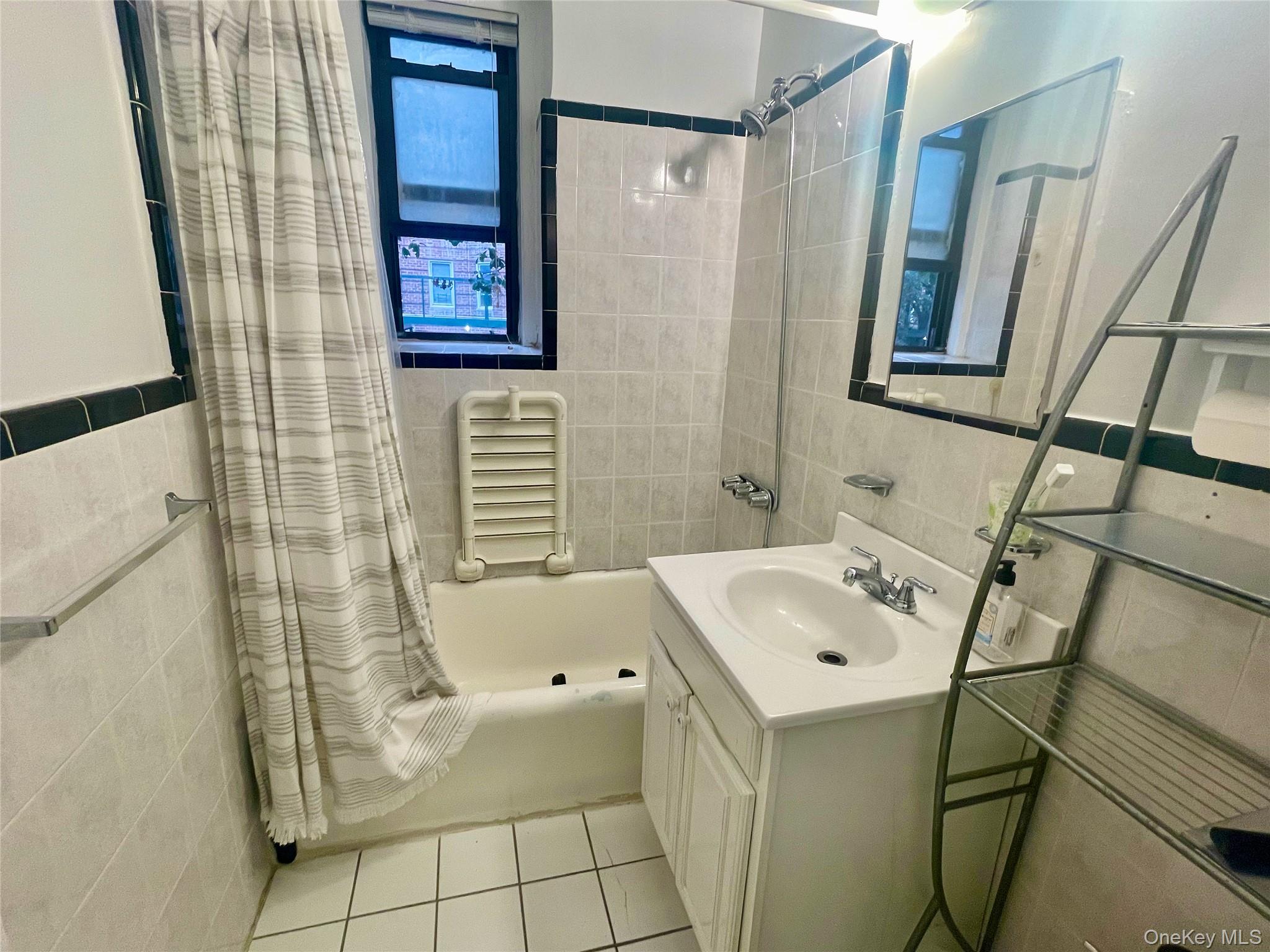 62-64 Saunders Street, Unit 1A Queens, NY 11374 - Photo 8 of 20 a bathroom with a sink and a shower