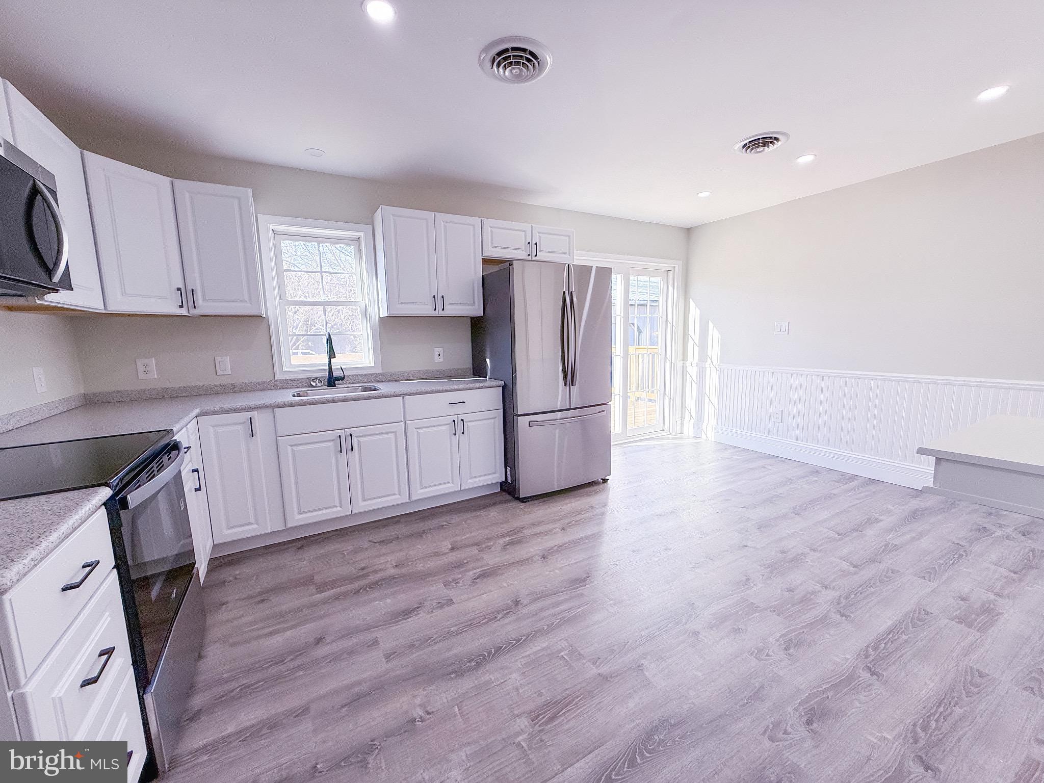 18558 Oak Road Bridgeville, DE 19933 - Photo 21 of 36 Bright and airy modern kitchen space.