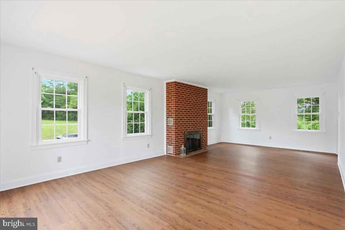 2447 Headquarters Road Edinburg, VA 22824 - Photo 12 of 58 Living Room wood burning fireplace