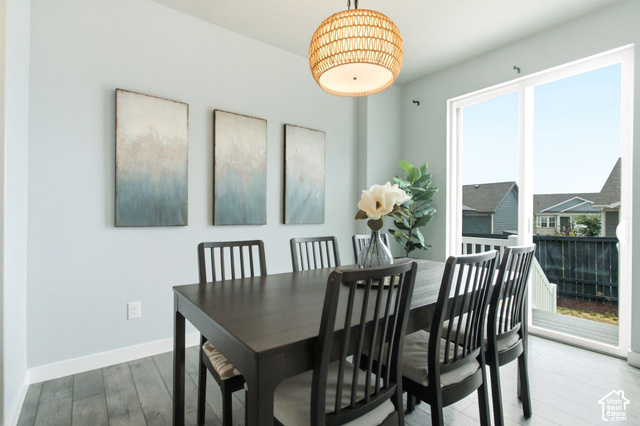 986 South Old Farm Road Heber City, UT 84032 - Photo 18 of 51 Wood-finish flooring, a woven pendant light fixture, and a sliding glass door providing outdoor access