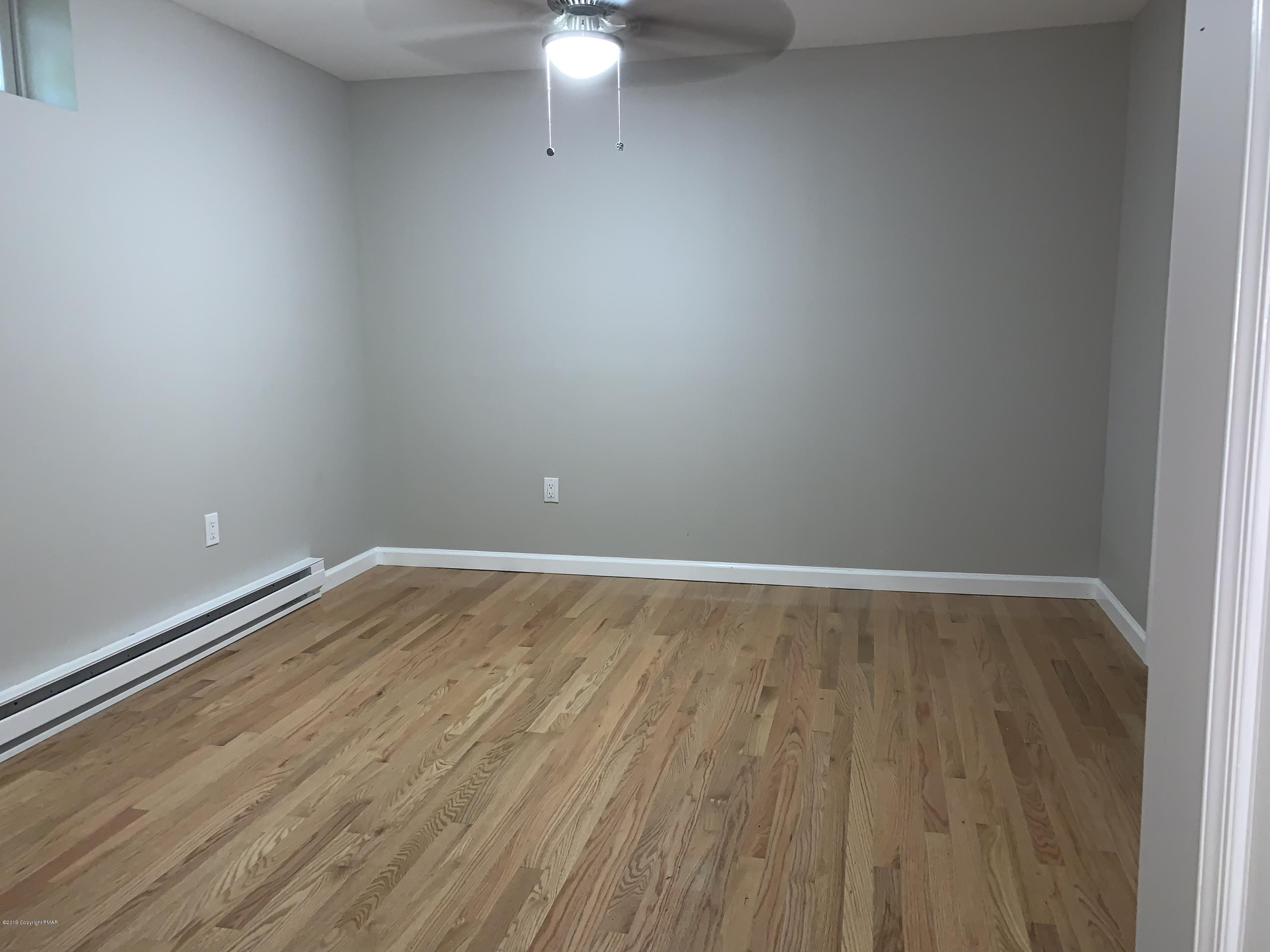 125 Edinburgh Road Bushkill, PA 18324 - Photo 13 of 19 a view of a room with wooden floor