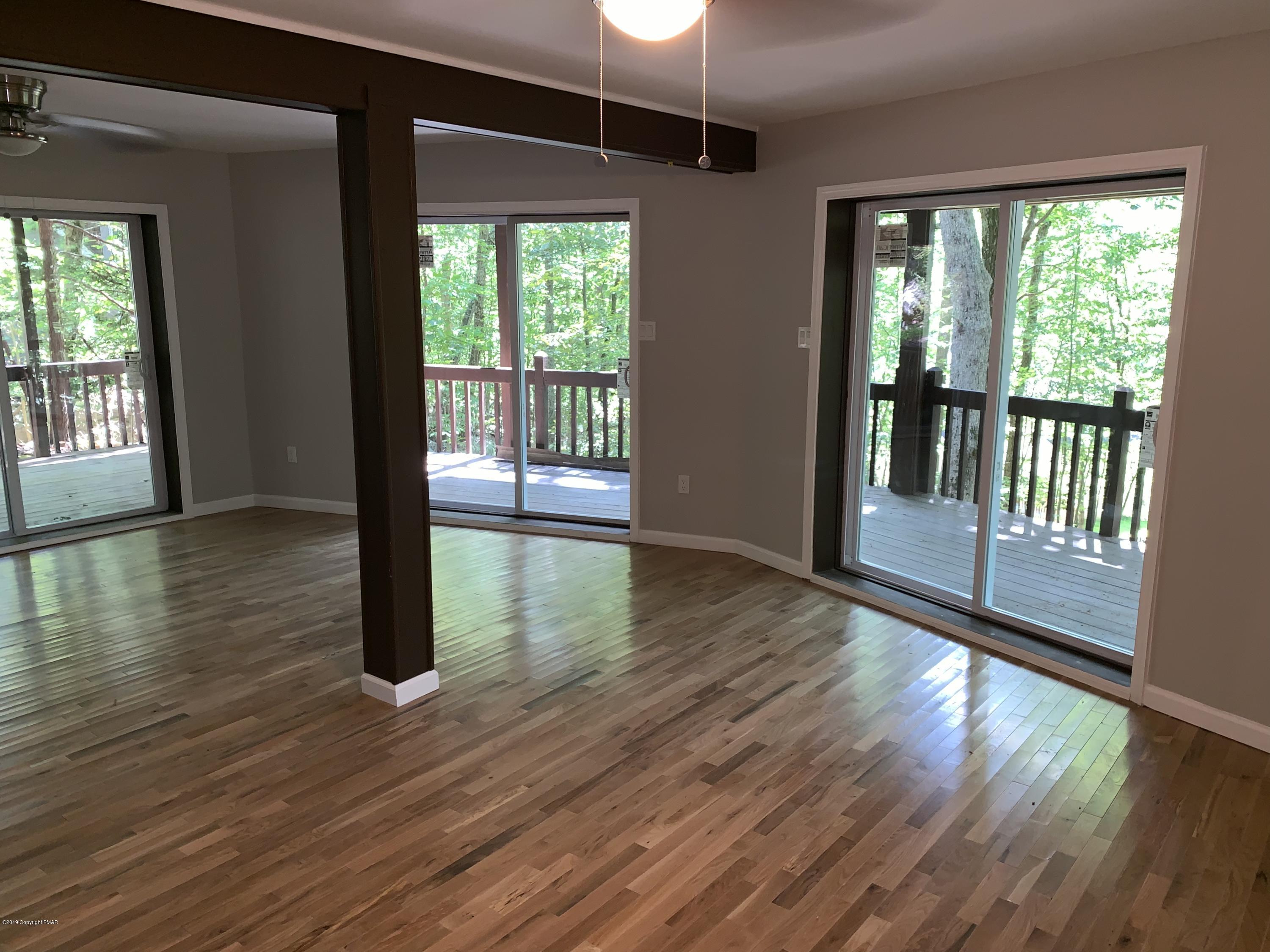 125 Edinburgh Road Bushkill, PA 18324 - Photo 14 of 19 a view of an entryway with wooden floor and door