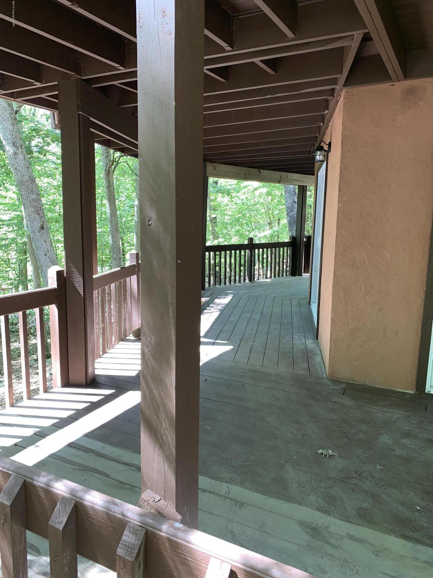 125 Edinburgh Road Bushkill, PA 18324 - Photo 17 of 19 a view of porch with wooden floor