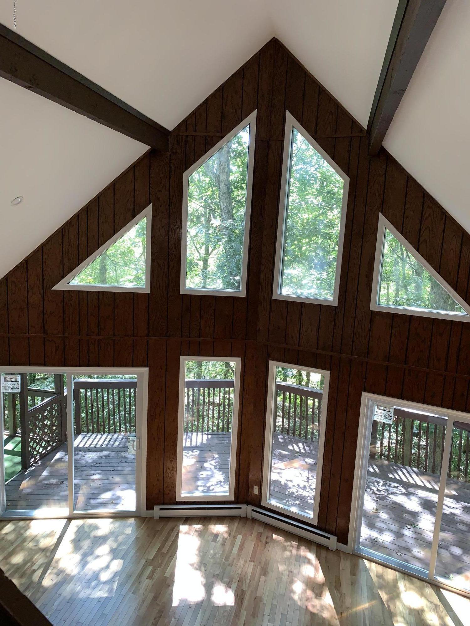125 Edinburgh Road Bushkill, PA 18324 - Photo 4 of 19 a view of a room with a large window