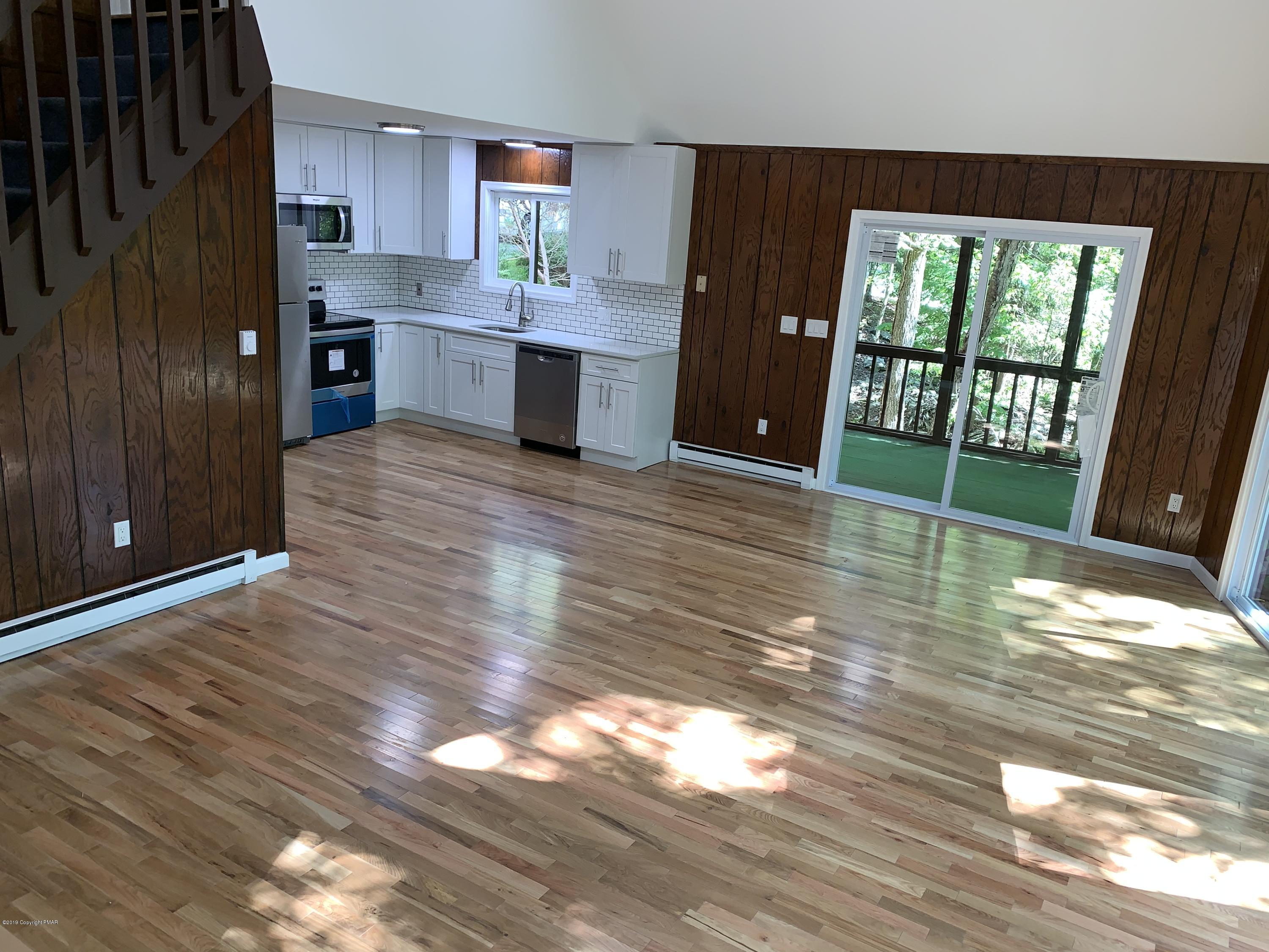 125 Edinburgh Road Bushkill, PA 18324 - Photo 7 of 19 a view of kitchen and hall with wooden floor