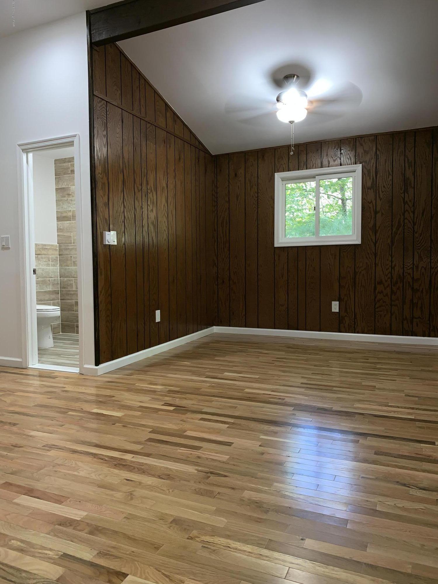 125 Edinburgh Road Bushkill, PA 18324 - Photo 10 of 19 a view of empty room with wooden floor
