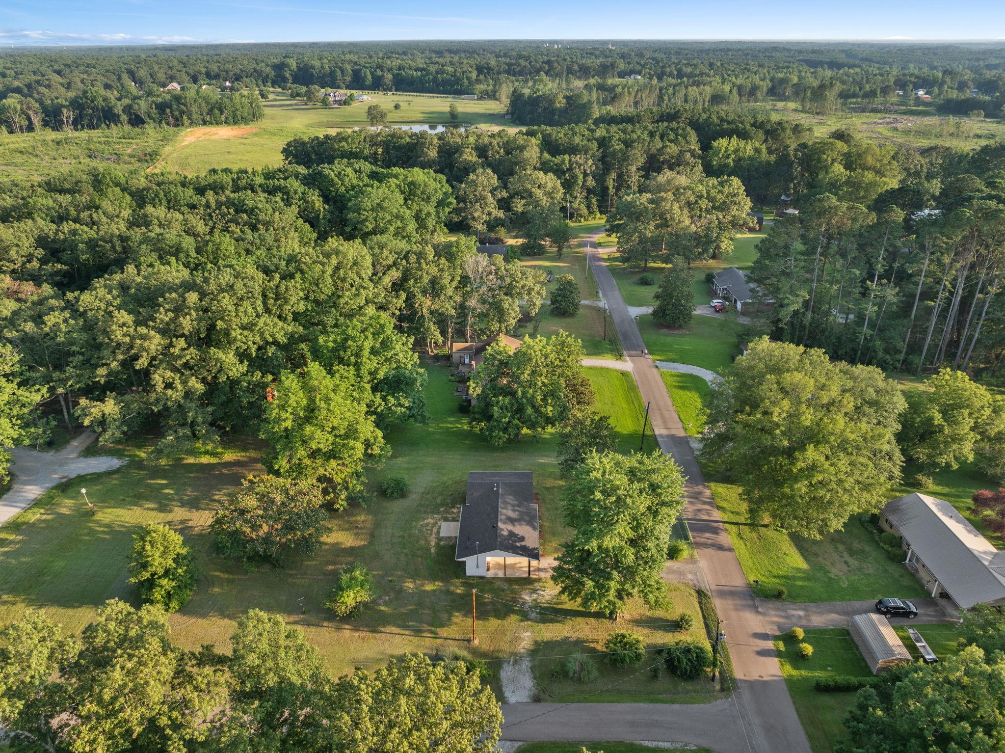 17 County Road 233 Corinth, MS 38834 - Photo 35 of 40 Aerial view of property and surrounding area featuring a forest