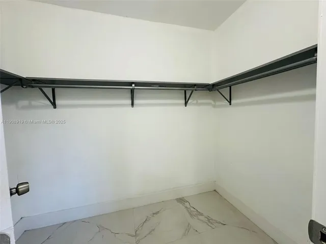 a view of small space with racks on the wall