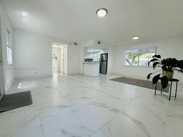 a view of a hallway with seating area