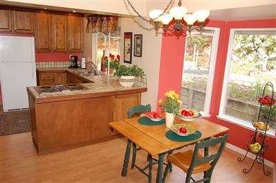 224 San Ramon Way Novato, CA 94945 - Photo 3 of 11 Kitchen with tile counters, upgraded ovens & dishwasher, breakfast room, built-in desk
