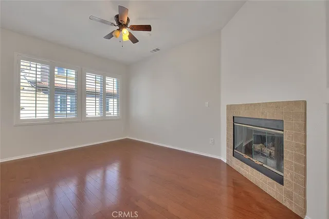 a kitchen with stainless steel appliances granite countertop a sink dishwasher a stove and a microwave oven with cabinets