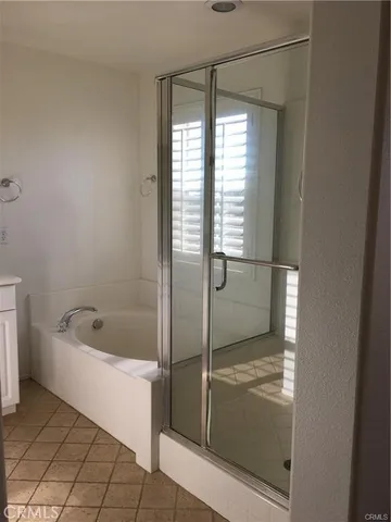 a bath tub sitting next to a shower