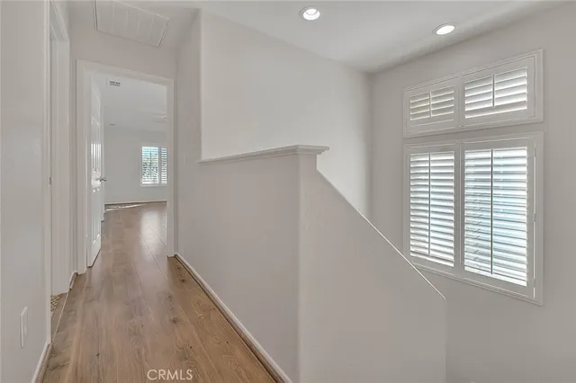 a bathroom with a tub a sink and a window