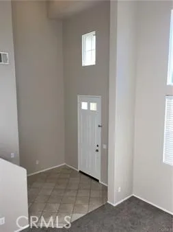 a view of an empty room with windows