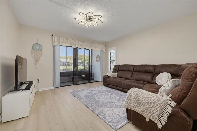 a view of a room with a large window and chair