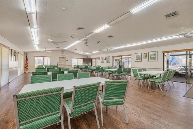 a view of a swimming pool with chairs