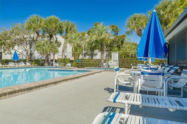 a view of a swimming pool with a lounge chair