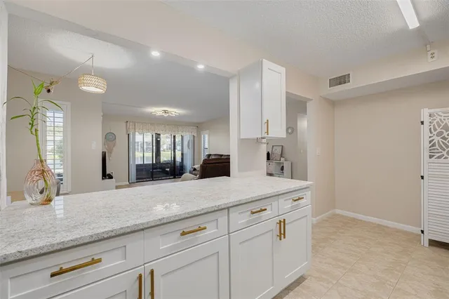 a view of a double vanity sink mirror and wooden cabinets