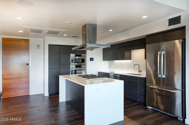 a kitchen with a stove and a sink