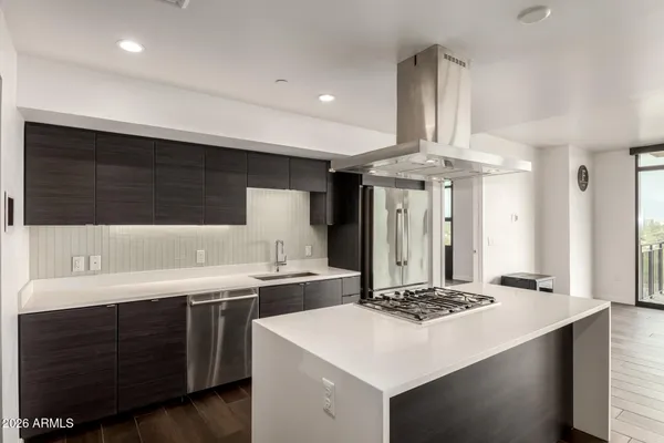 a bathroom with a double vanity sink a toilet and a mirror