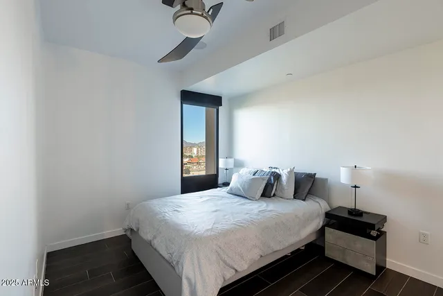 a bedroom with a bed and a view of bathroom