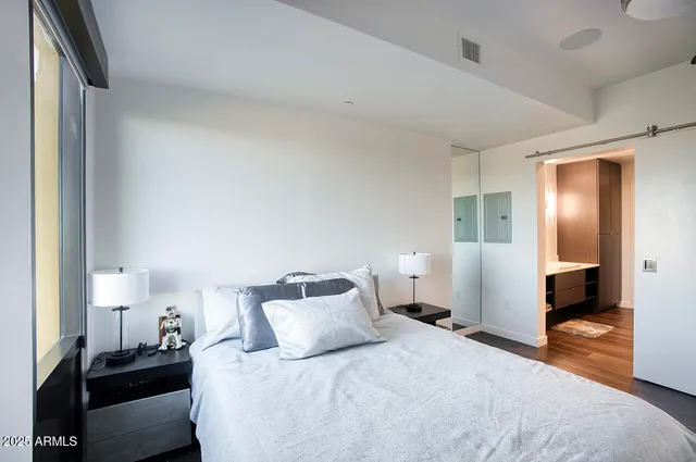 a bathroom with a double vanity sink a and mirror