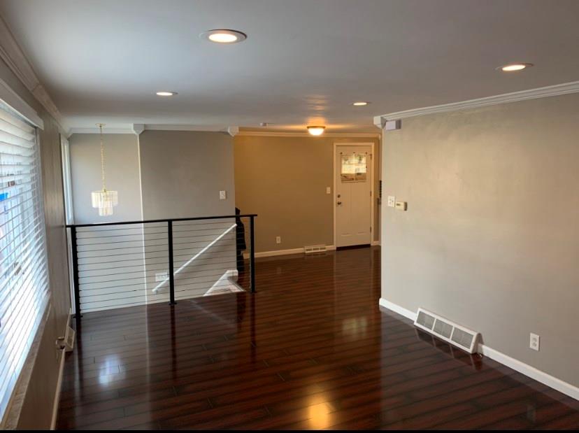 519 Idlewood Road Pittsburgh, PA 15235 - Photo 13 of 25 Huge living room with brand new floors leading to open concept dine in kitchen
