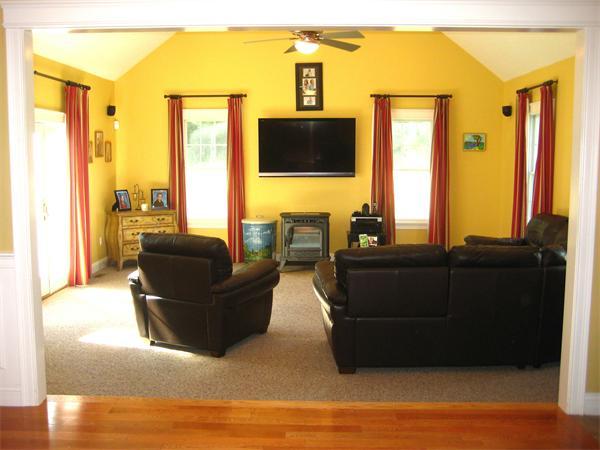 6 Colby Road Danvers, MA 01923 - Photo 12 of 21 a living room with couches and a flat screen tv with wooden floor