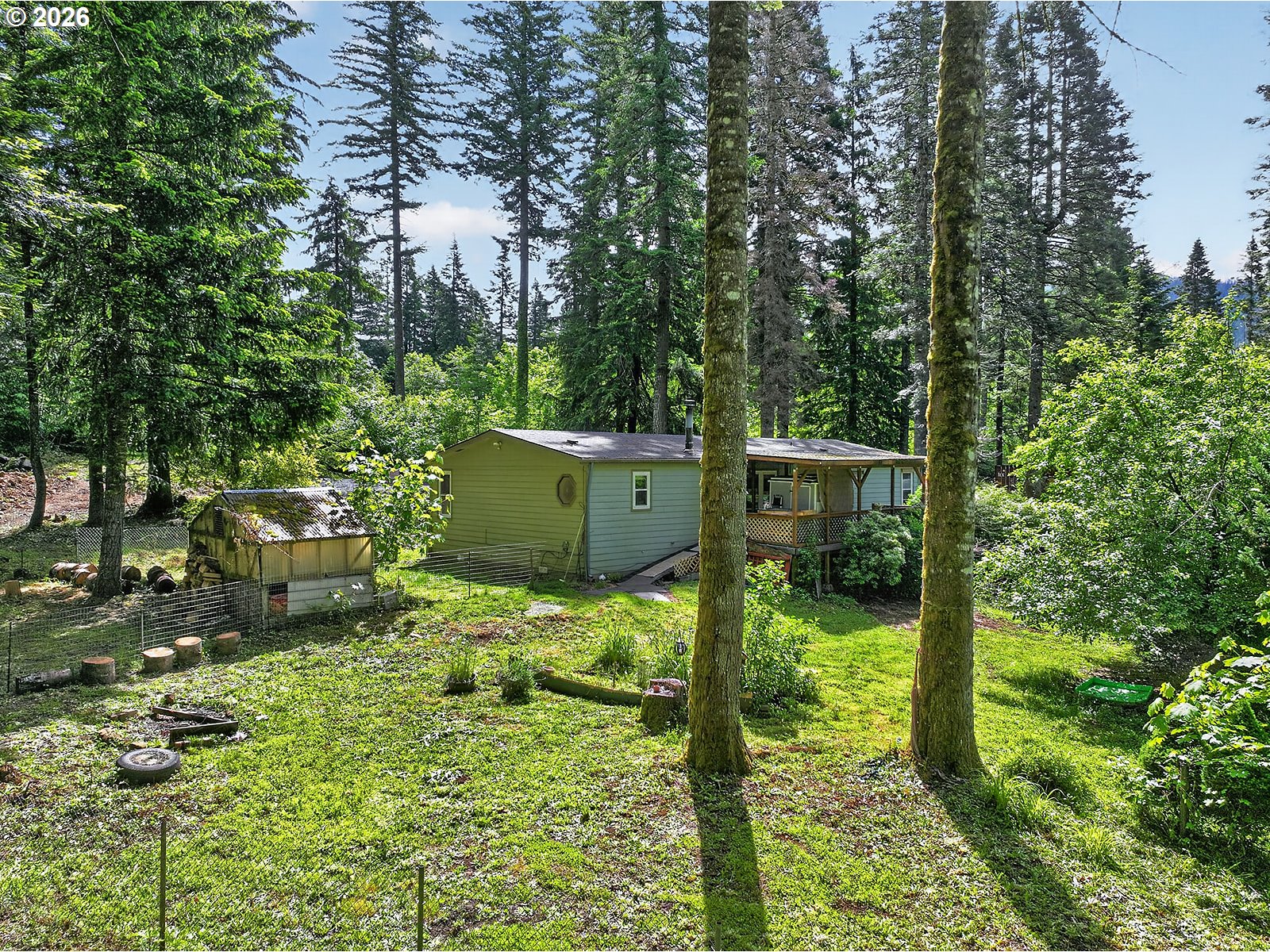 142 Spring Lane South Stevenson, WA 98648 - Photo 24 of 29 a backyard of a house with a yard and outdoor seating